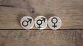 Gender equality conceptual image. Male and female symbol on wooden circles on beautiful wooden background. Copy space Royalty Free Stock Photo