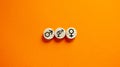 Gender equality conceptual image. Male and female symbol on wooden circles on beautiful orange background. Copy space