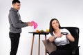 Gender neutrality. The woman plays a game while the guy wipes the dishes. White background