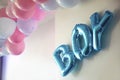 gender reveal party blue and pink balloons in living room on white wall definition of a boy or girl, gathering party party Royalty Free Stock Photo