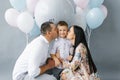 Gender reveal party. A young family waiting for their second child against the background of a pop ball to determine the sex of Royalty Free Stock Photo