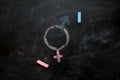 Gender symbols or signs for the male and female sex drawn on a blackboard