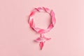 Gender Venus symbol made of beautiful flower petals on candy pink background