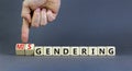 Gendering or misgendering symbol. Concept words Gendering Misgendering on wooden blocks. Beautiful grey table grey background.