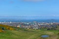 General aerial view from the Holyrood Park to the Edinburgh downtown city, buildings and sea on background Royalty Free Stock Photo