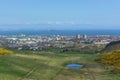 General aerial view from the Holyrood Park to the Edinburgh downtown city, buildings and sea on background Royalty Free Stock Photo