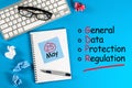 General Data Protection Regulation or GDPR - note at blue desk with office supplies