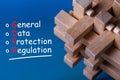 General Data Protection Regulation GDPR - Text on blue background with wooden brain teaser. Data Protection Concept.