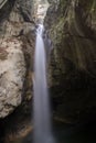 General front view of Samandere Waterfall plashing from high rocks surrounded by forest Royalty Free Stock Photo