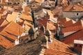 General plan of old orange roofs of houses with shabby chimneys and antennas. Royalty Free Stock Photo