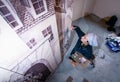 Woman artist working on a wall painting.