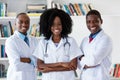 General practitioner and doctor and nurse as african american medical team Royalty Free Stock Photo