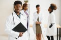 General practitioner and doctor and nurse as african american medical team at hospital. Royalty Free Stock Photo