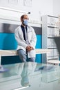 General practitioner with uniform sitting in checkup visit office Royalty Free Stock Photo
