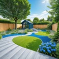 general view of back garden with artificial grey paving slab flower bed with