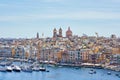 General view on Birgu town waterfront and skyline in bay with colorful boats in Malta
