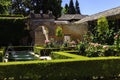 General view of The Generalife courtyard, with its famous fountain and garden. Alhambra de Granada complex Royalty Free Stock Photo