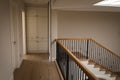 General view of house interior with spacious hallway and staircase