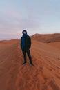 General view of a man with a Berber scarf from the top of a dune in the Sahara desert Royalty Free Stock Photo