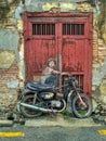 General view of a mural `Boy on a Bike` painted by Ernest Zacharevic in Penang on July 6, 2013. The mural is one of the 9 murals