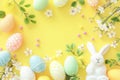 Happy easter grinning Eggs Submerged Easter Treats Basket. White bunny purse Bunny Folk Tale. viburnums background wallpaper Royalty Free Stock Photo