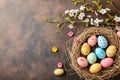 Happy easter Pine Green Eggs Pastel bold pink Basket. White bunny ears Bunny Faberge. warren background wallpaper Royalty Free Stock Photo