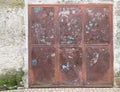 Old rusty metal door with graffiti on it Royalty Free Stock Photo