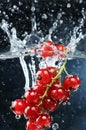 bunch of currants falling into water, with splashes, freshness, Generated image