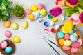 Easter egg painting at the kitchen table. Royalty Free Stock Photo