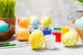 Easter egg painting at the kitchen table. Royalty Free Stock Photo