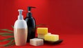 Bottles of shampoo and soap bars on red background with copy space Royalty Free Stock Photo