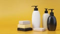 Bottles of shampoo and soap bars on yellow background with copy space Royalty Free Stock Photo