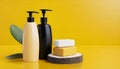 Bottles of shampoo and soap bars on yellow background with copy space Royalty Free Stock Photo