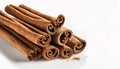 Aromatic cinnamon sticks on white background with copy space