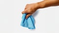 arm holding light blue microfiber cloth Royalty Free Stock Photo