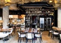Modern restaurant interior with wine refrigerators and a large assortment of alcoholic drinks in Riga