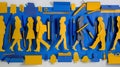 cobalt blue and yellow paper people cutouts