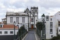 View of Nordeste old stone arch bridge in Nordeste village with white town buildings. Sao Miguel, Azores Royalty Free Stock Photo