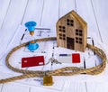 Home loan concept. Wooden house, rope knot, hourglass, house keys, credit cards Generated image