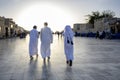 Happy Arabic kids wearing traditional Arabian gulf clothes in wakra Souq Doha Qatar. Royalty Free Stock Photo