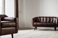 Living room. Living room with leather armchair on empty wall background. Royalty Free Stock Photo