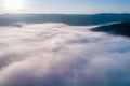 Fog. Surreal beautiful forest with fog. Aerial view. Beautiful sunrise above the forest with heavy fog Royalty Free Stock Photo