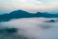 Fog. Surreal beautiful forest with fog. Aerial view. Beautiful sunrise above the forest with heavy fog Royalty Free Stock Photo