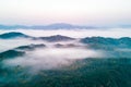 Fog. Surreal beautiful forest with fog. Aerial view. Beautiful sunrise above the forest with heavy fog Royalty Free Stock Photo