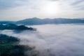 Fog. Surreal beautiful forest with fog. Aerial view. Beautiful sunrise above the forest with heavy fog Royalty Free Stock Photo