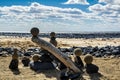 Pretty pile of wooden pebbles and balls of sand facing the sea