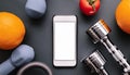A smartphone with white screen and weightlifting on metal background Royalty Free Stock Photo