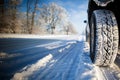 Close up of a car tire covered in snow Royalty Free Stock Photo