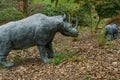 Nature-Inspired Realistic Rhino Sculptures in a Woodland Setting. Royalty Free Stock Photo