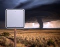 Blank white street sign isolated on a field during tornado season Royalty Free Stock Photo